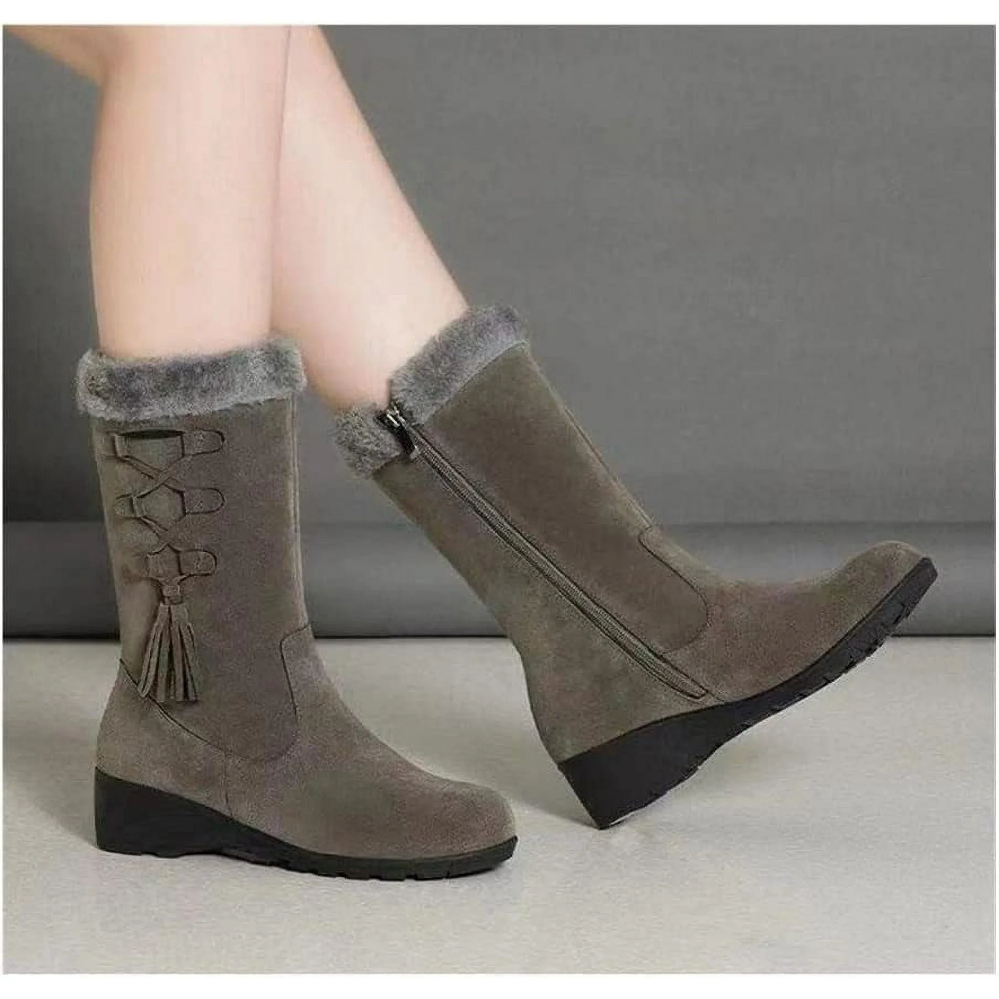 Women's gray suede winter boots with faux fur lining, side zipper, and tassel detail. Stylish, warm footwear for cold weather.