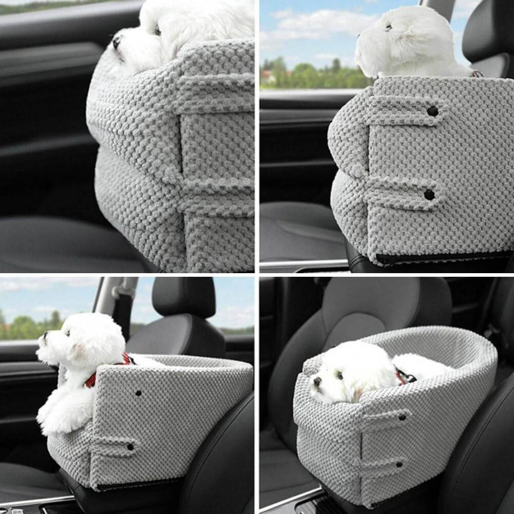 Small white dog in a gray knitted car seat booster, providing comfort and safety during travel. Ideal pet accessory for secure car rides.