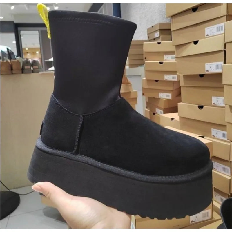 Black women's snow boot with plush lining, waterproof, anti-slip sole, and platform design. Ideal for winter outdoor activities.