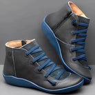 Stylish black leather high-top sneakers with blue laces and soles, featuring a side zipper. Perfect for casual wear and fashion-forward looks.