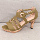 Olive green strappy high heel sandal with cork sole, featuring buckle detail and open toe design. Perfect for summer fashion and casual wear.