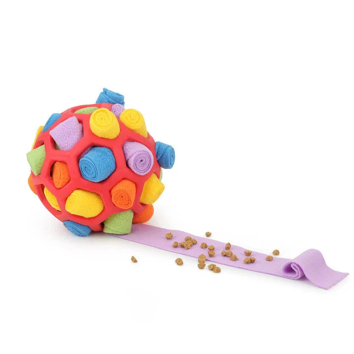 Colorful interactive dog toy ball with treat pockets, featuring vibrant geometric patterns and a purple fleece strip, ideal for pet enrichment.