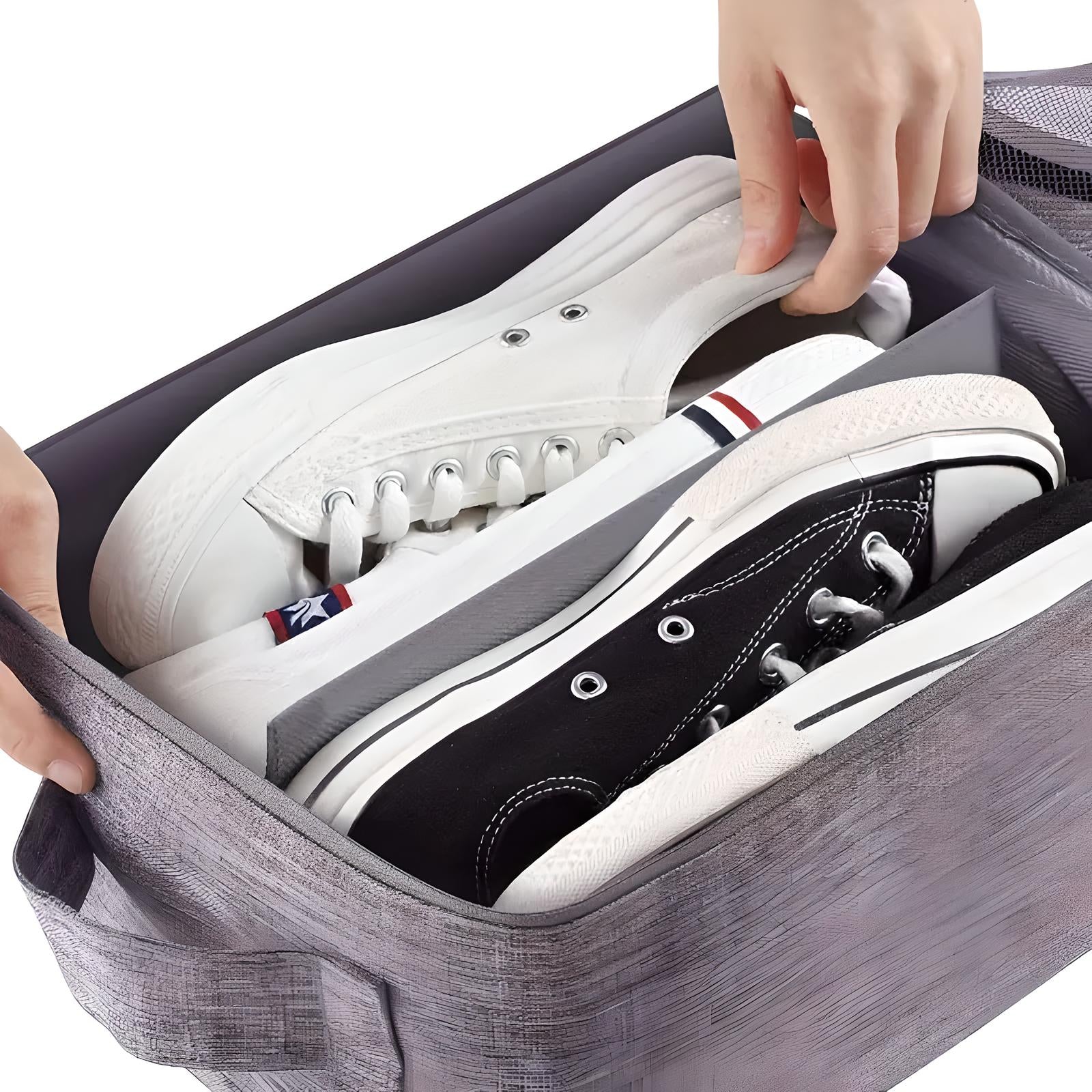 Hands organizing white and black canvas sneakers in a gray storage box. Shoe storage solution, sneaker organization, closet organization ideas.