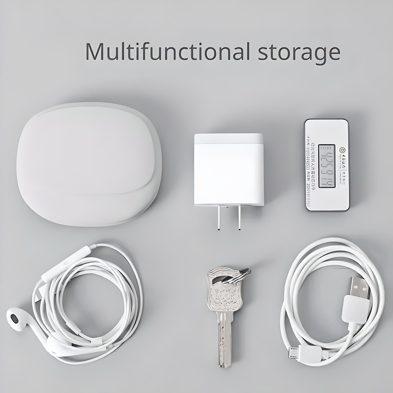 Multifunctional storage organizer with USB charger, digital thermometer, earphones, keys, and cable on a gray background. Ideal for home organization.