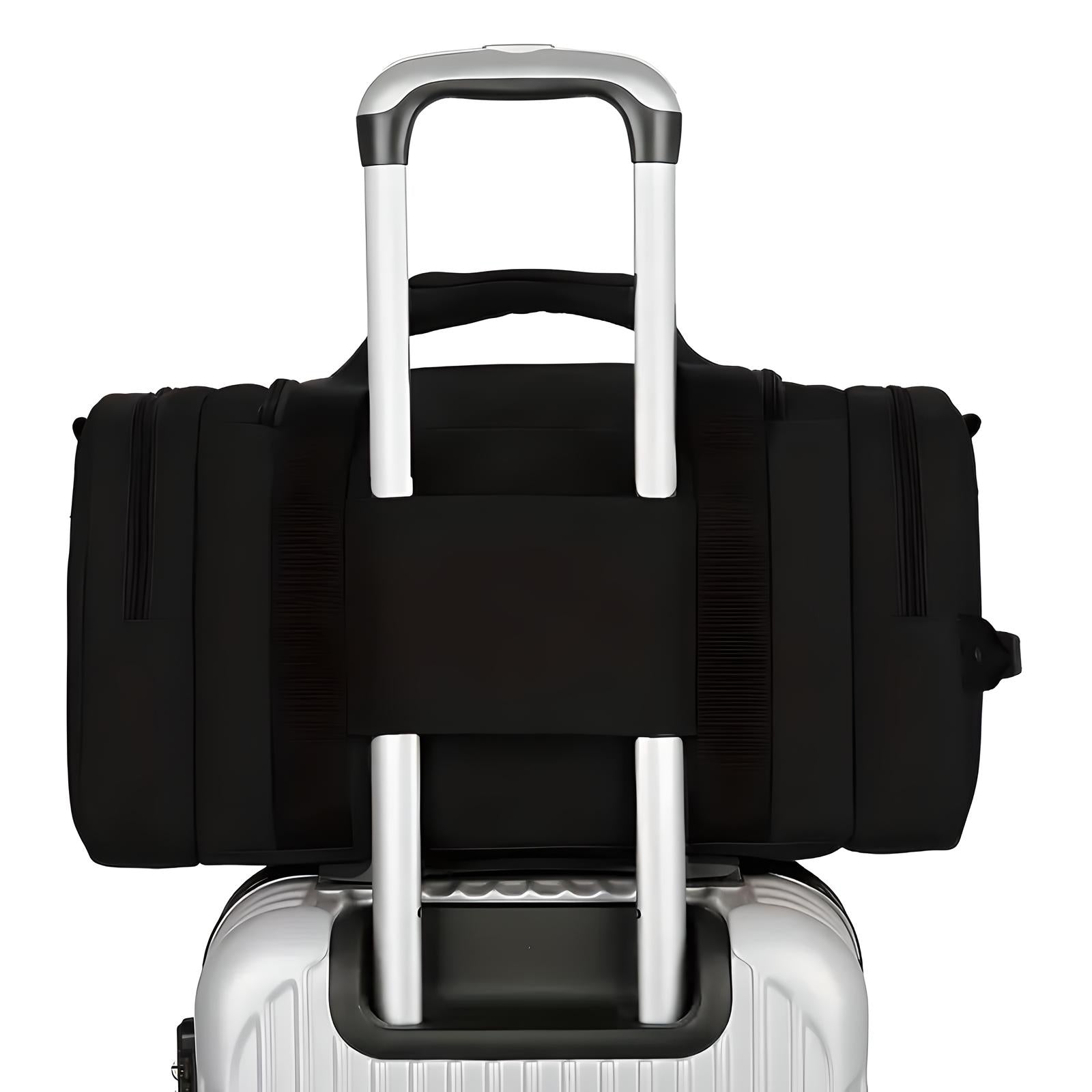 Black travel duffel bag securely attached to a silver hard-shell suitcase with telescopic handle, ideal for convenient airport luggage transport.