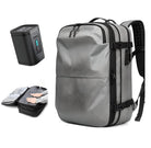 Sleek gray travel backpack with multiple compartments, ergonomic straps, and a portable power bank. Ideal for tech-savvy travelers and commuters.