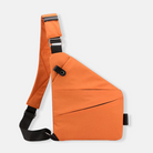 Orange crossbody sling bag with adjustable strap, modern design, and secure pockets. Ideal for travel and daily use. Stylish and functional accessory.