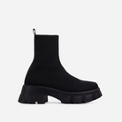 Black chunky sole platform sock boots for women, featuring stretch fabric, mid-calf height, and thick heel. Perfect for autumn and winter fashion.