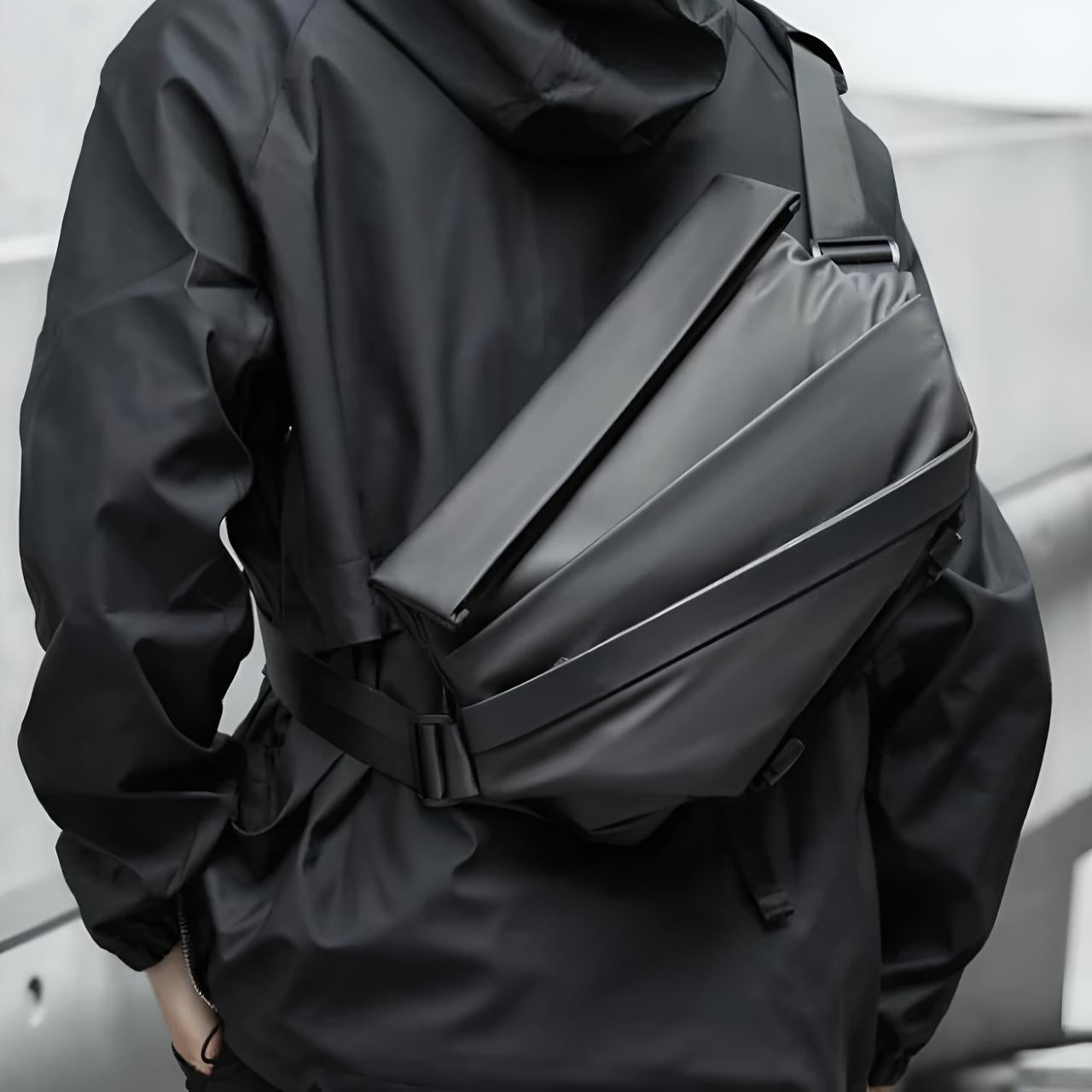 Sleek black crossbody bag on person wearing a black jacket, showcasing modern urban fashion style. Ideal for travel, daily use, and tech-savvy individuals.