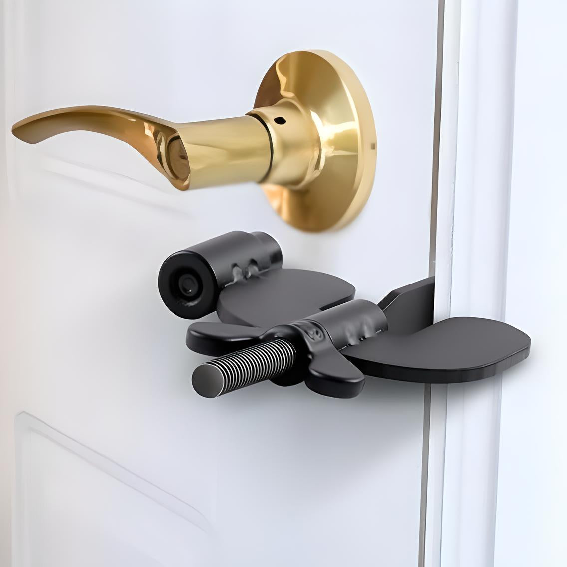 Door security bar lock on white door with gold handle, providing enhanced home safety. Adjustable black metal design for increased protection.