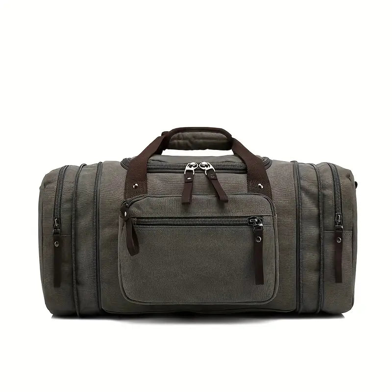 Olive green canvas duffel bag with multiple zippered compartments, brown handles, and adjustable shoulder strap, ideal for travel and gym use.