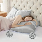 Woman sleeping on luxurious silver silk pillowcase in elegant bedroom setting, highlighting comfort and elegance. Silk bedding, sleep, relaxation.