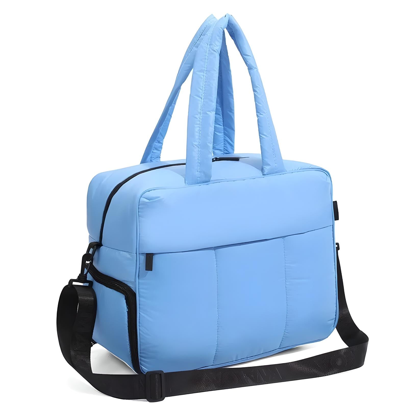 Light blue travel duffel bag with padded handles and adjustable shoulder strap, featuring a front zipper pocket. Ideal for gym, travel, or weekend trips.