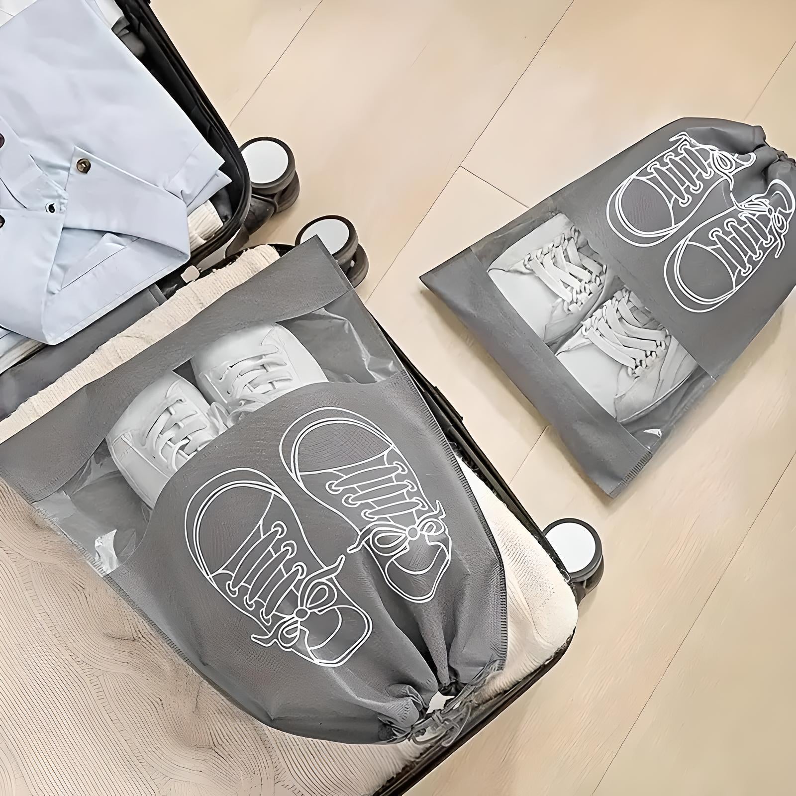 Travel suitcase with organized packing cubes and shoe bags, featuring white sneakers. Efficient luggage organization for travel.