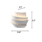 Modern white wall sconce with layered design, dimensions 9.84" x 6.3", emits soft ambient light, ideal for contemporary home decor lighting.