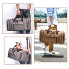 Stylish canvas duffel bags in gray and brown, featuring leather straps and multiple pockets, perfect for travel and gym use.