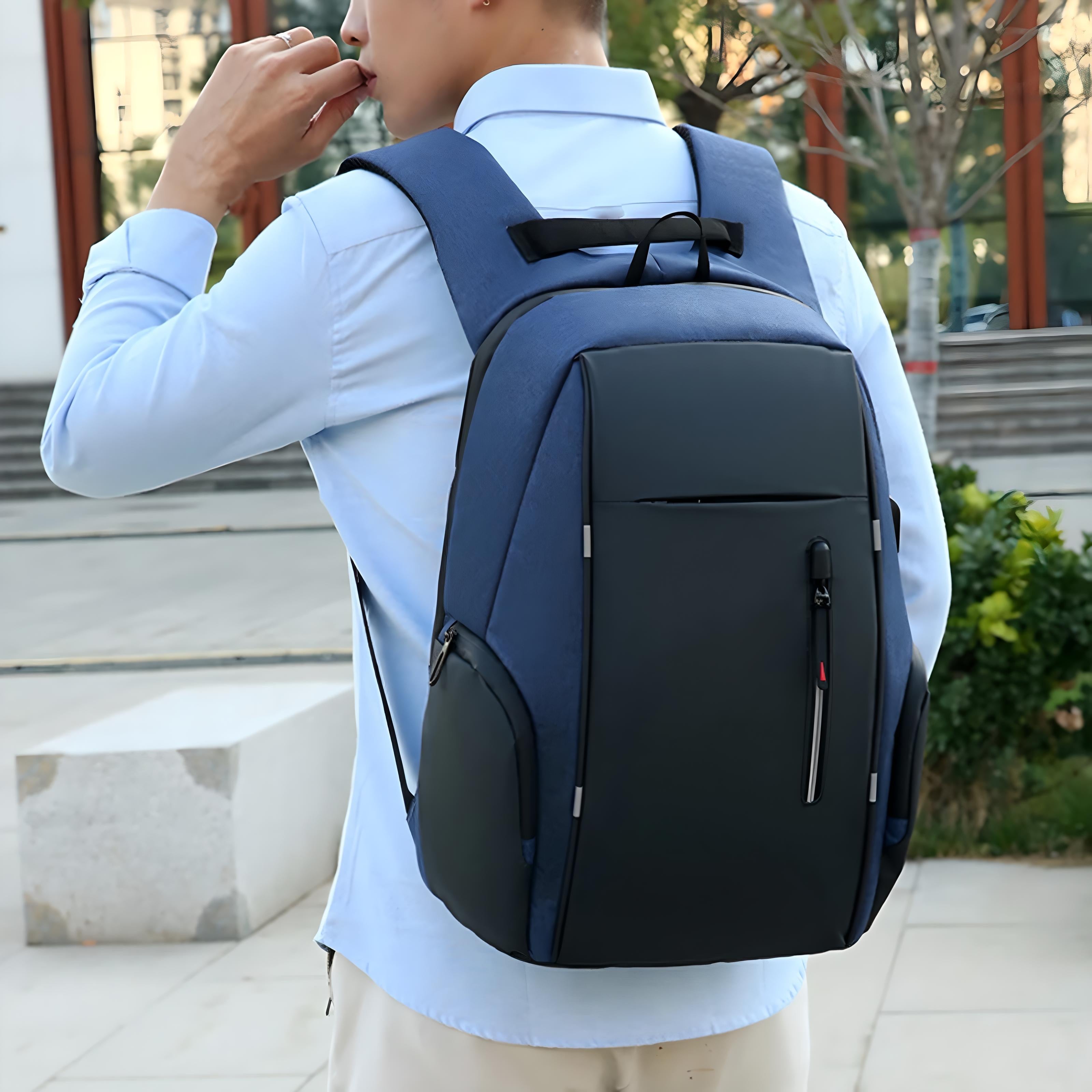 Man wearing a sleek, modern anti-theft backpack in urban setting; features durable material, ergonomic design, ideal for travel and daily use.