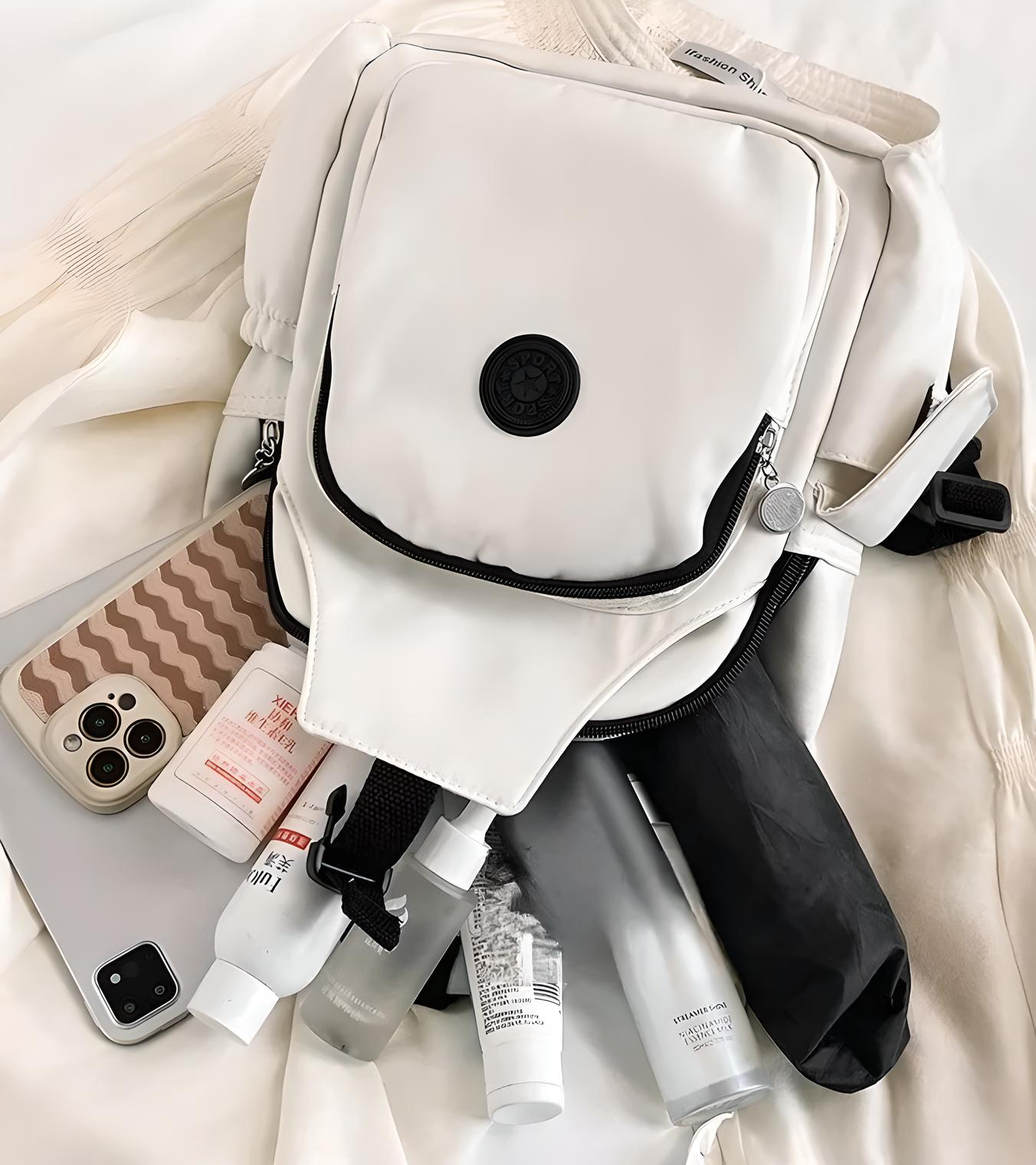 White backpack with skincare products, iPhone, and laptop on a beige fabric. Minimalist travel essentials, tech gadgets, beauty items, modern lifestyle.