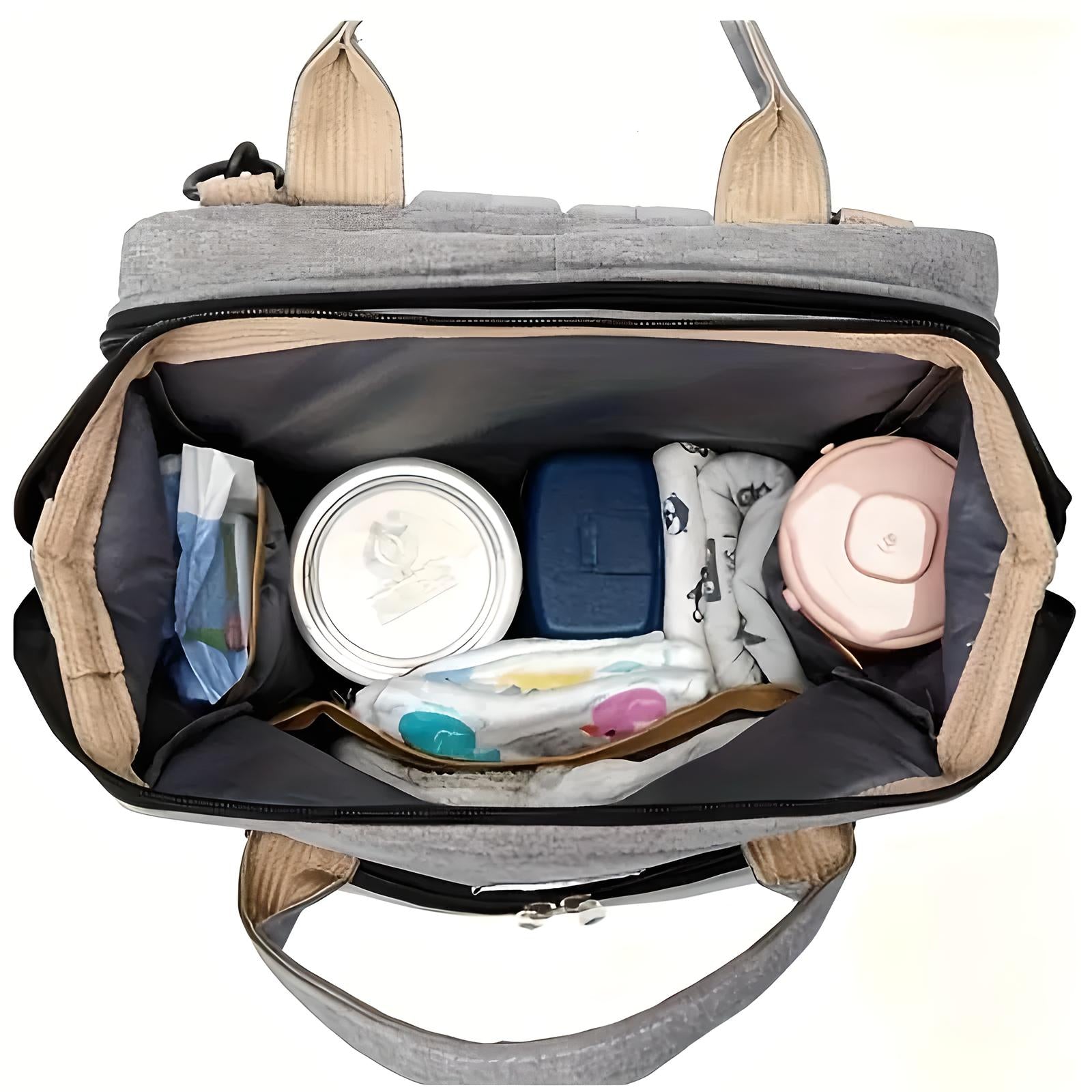 Top view of an organized diaper bag with baby essentials: wipes, formula container, diapers, and bottles. Perfect for parents on-the-go.