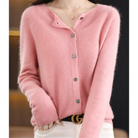 Pink cashmere cardigan sweater with button-up front, worn by a model, stylish women's fashion.