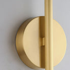 Modern gold wall sconce with sleek cylindrical design, brushed metal finish, and minimalist aesthetic. Ideal for contemporary interior lighting.