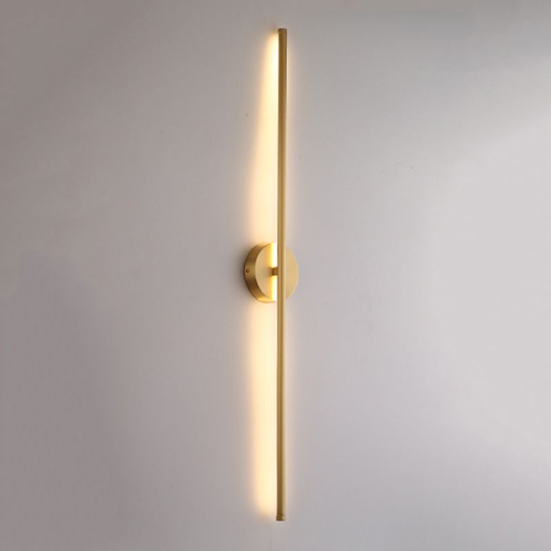 Modern vertical LED wall sconce with gold finish, minimalist design, warm ambient lighting, ideal for contemporary home decor and interior design.