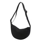 Black crossbody sling bag with adjustable strap, minimalist design, and durable fabric. Ideal for travel, daily use, and outdoor activities.