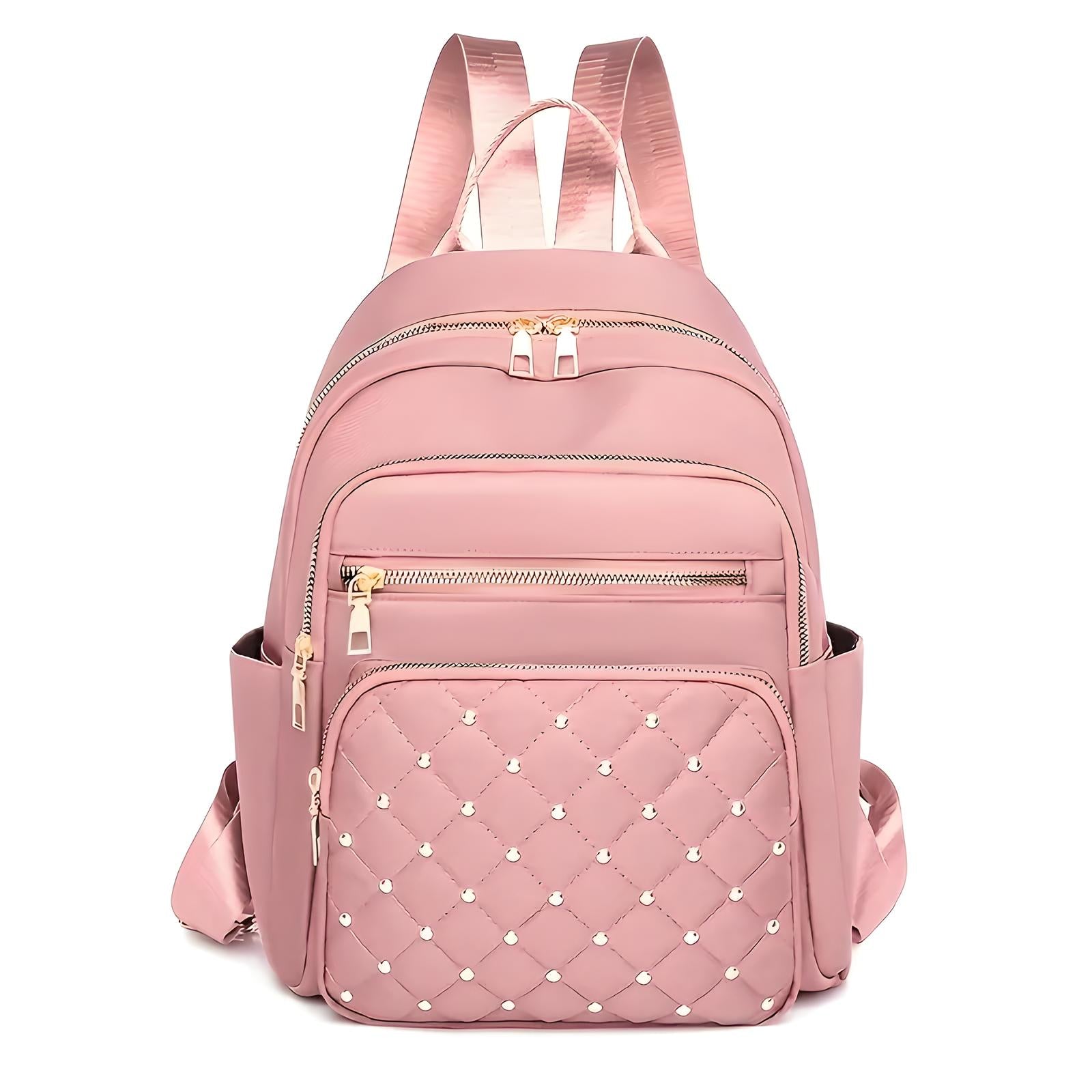 Pink quilted backpack with pearl embellishments, multiple zippered compartments, and adjustable straps. Stylish women's fashion accessory.