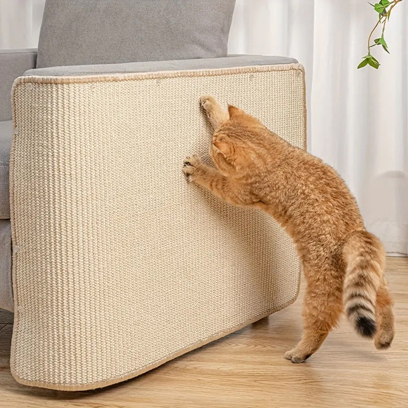 Cat scratching beige sisal fabric on sofa armrest, home furniture protection, pet-friendly decor, indoor cat activity, scratch-resistant cover.