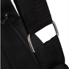 Close-up of a black adjustable nylon strap with metal buckle, ideal for backpacks or bags. Durable, high-quality material for secure fastening.