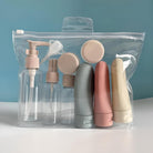 Travel toiletry bottles set in a clear zippered bag, featuring pump, spray, and squeeze bottles. Ideal for travel, TSA-approved, leak-proof containers.