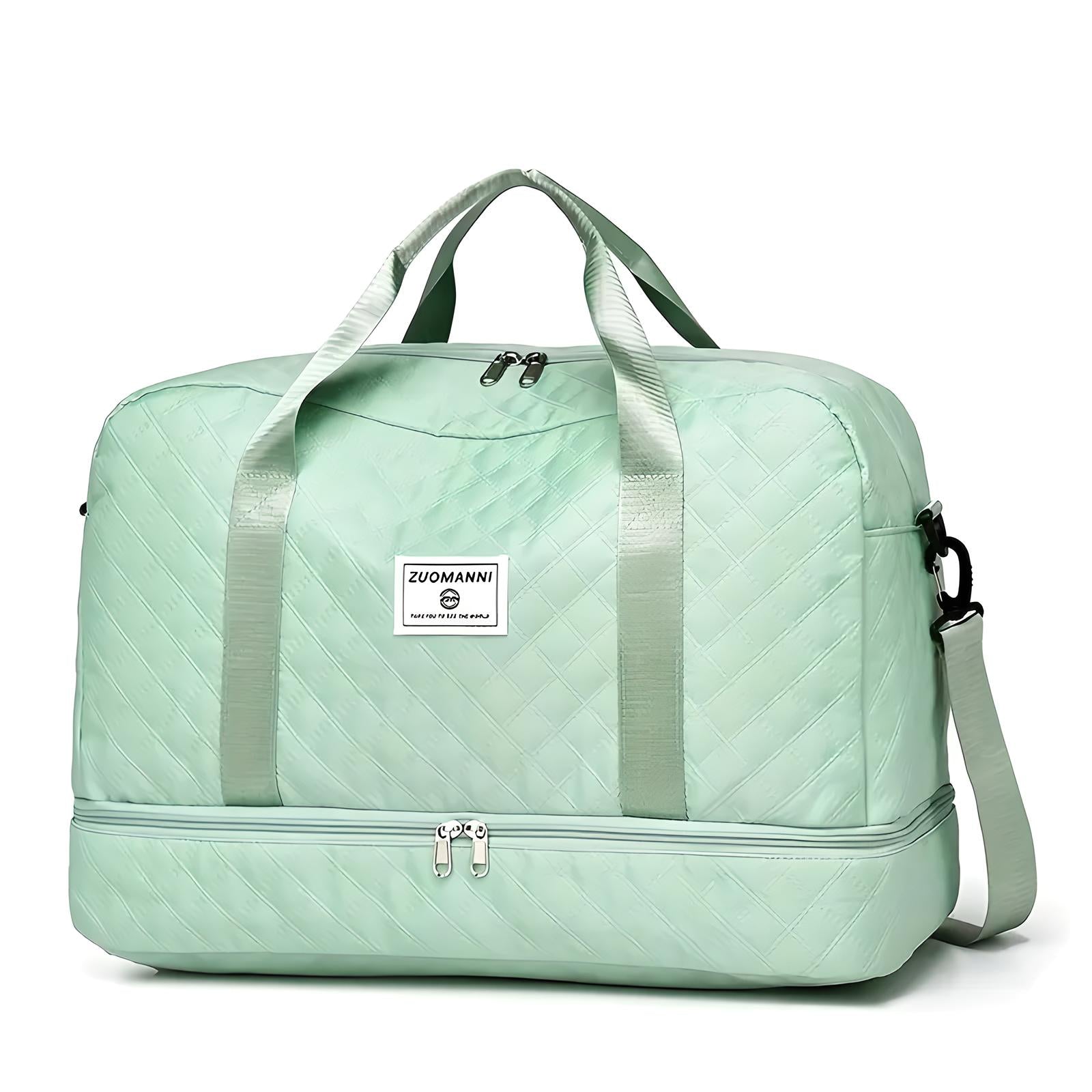 Mint green quilted travel duffel bag with dual handles, adjustable shoulder strap, and spacious compartments. Ideal for weekend trips and gym use.