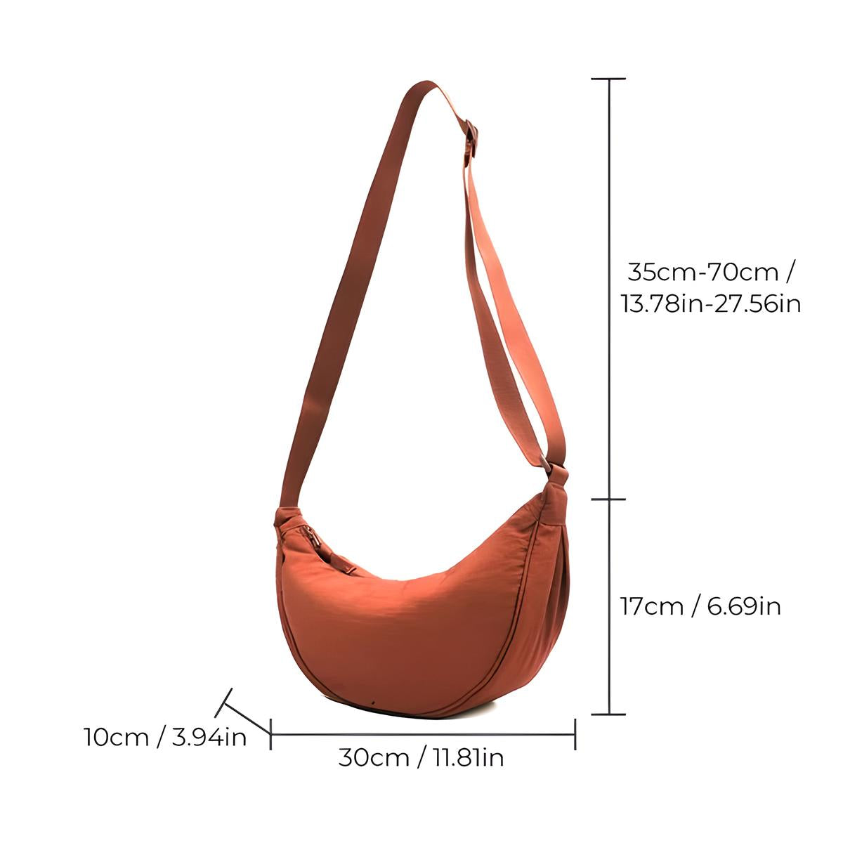 Rust orange crescent shoulder bag with adjustable strap, dimensions: 30cm x 10cm x 17cm. Stylish crossbody accessory for women.