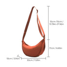 Rust orange crescent shoulder bag with adjustable strap, dimensions: 30cm x 10cm x 17cm. Stylish crossbody accessory for women.