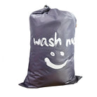 Large waterproof laundry bag with "wash me" text and smiley face design, ideal for travel and home use. Durable, lightweight, and easy to carry.