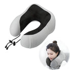 Travel neck pillow with adjustable drawstrings, ergonomic design, and breathable mesh fabric. Ideal for airplane travel comfort and neck support.