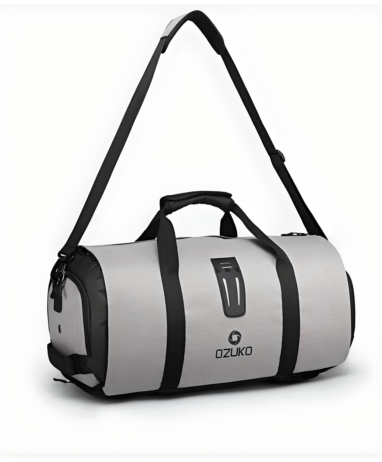 Gray Ozuko duffel bag with black straps, adjustable shoulder strap, and logo. Ideal for travel, gym, or sports. Durable and stylish design.