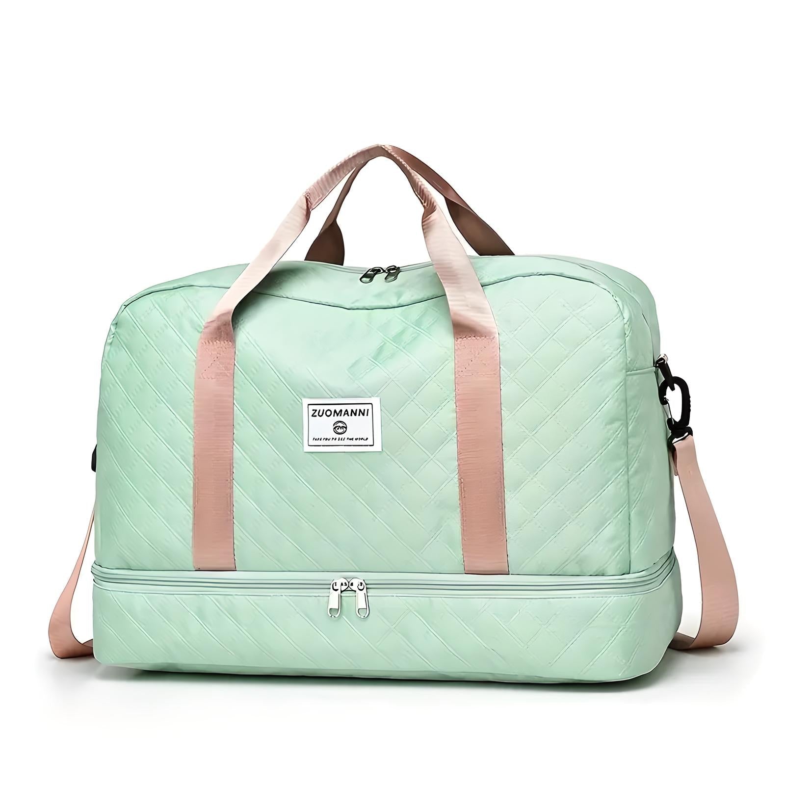 Mint green quilted travel duffel bag with beige handles and detachable shoulder strap, featuring a spacious design and front logo patch.