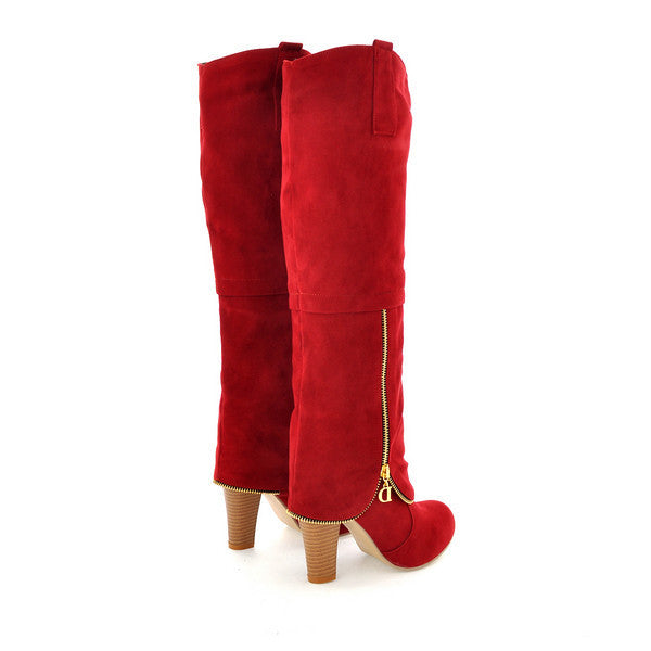 Red knee-high suede boots with side zippers and wooden block heels, stylish women's footwear, perfect for fashion-forward fall and winter outfits.