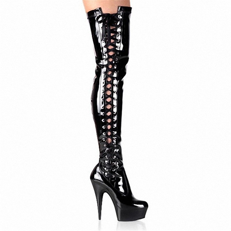 Shiny black patent leather thigh-high boots with stiletto heels and lace-up front. Fashionable, high-heeled footwear for women.