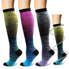 Colorful gradient compression socks for men and women, featuring knee-high design, breathable fabric, and graduated support for improved circulation.