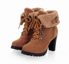 Women's brown suede high-heeled ankle boots with faux fur lining, lace-up design, and chunky heel. Stylish winter footwear for women.