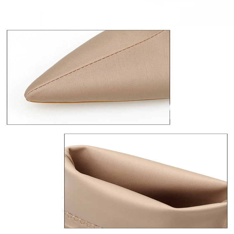 Close-up of beige satin pointed-toe high heel shoe, highlighting sleek design and smooth texture. Fashion footwear, elegant women's shoes.