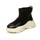 Black leather sock sneaker with ribbed knit upper and chunky white sole, stylish high-top design, trendy footwear for casual wear.