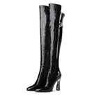 Sleek black patent leather knee-high boots with textured design and unique block heels, perfect for fashion-forward style and luxury footwear enthusiasts.