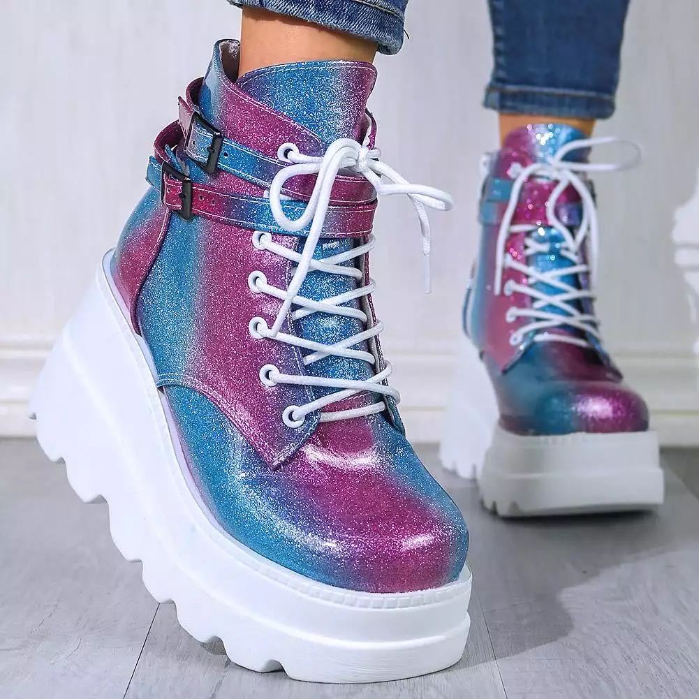 Colorful holographic platform boots with chunky white soles and lace-up design, featuring ankle straps. Trendy women's fashion footwear.