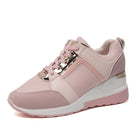 Pink women's fashion sneaker with metallic accents, mesh panels, and a white sole. Stylish, comfortable footwear for casual wear.