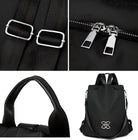 Stylish black backpack with adjustable straps, silver zippers, and leather handle. Modern design, perfect for travel or daily use. High-quality material.