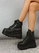 Black platform ankle boots with chunky heels and lace-up design, featuring side zippers and buckle straps, perfect for trendy women's fashion footwear.