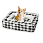 Corgi sitting in a black and white plaid dog bed, cozy pet furniture, comfortable plush bedding for small to medium dogs, stylish home decor.